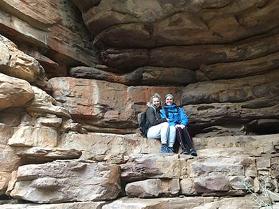 Southern-Flinders-Ranges-walking-tour-for-women-wellness-walks-hikers-sitting-rock-escarpment